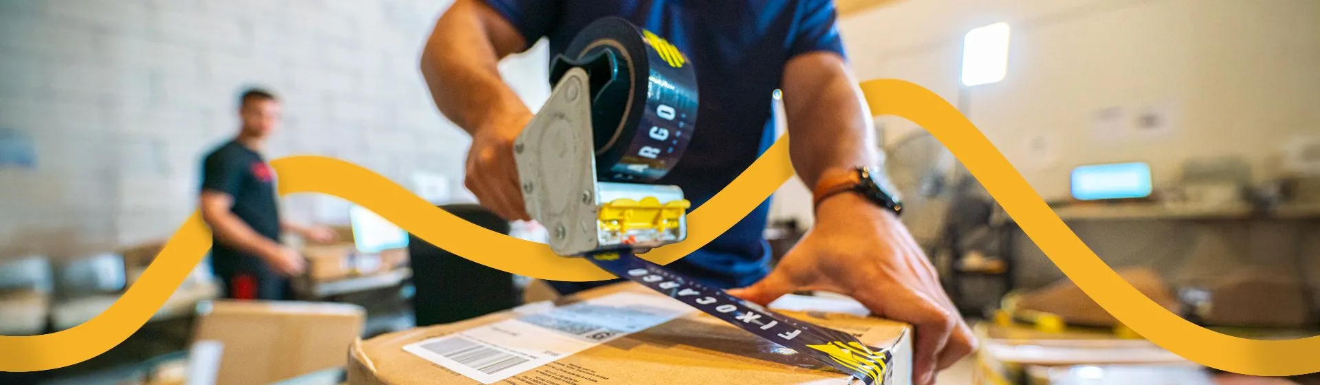 Fixo Cargo employee sealing a box